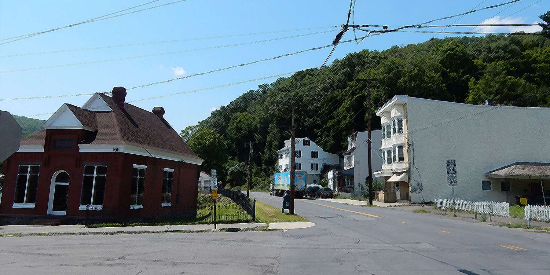 Photo of East Mahanoy Avenue with houses and trees on a sunny day in Girardville, Pennsylvania Photo of East Mahanoy Avenue with houses and trees on a sunny day in Girardville, Pennsylvania