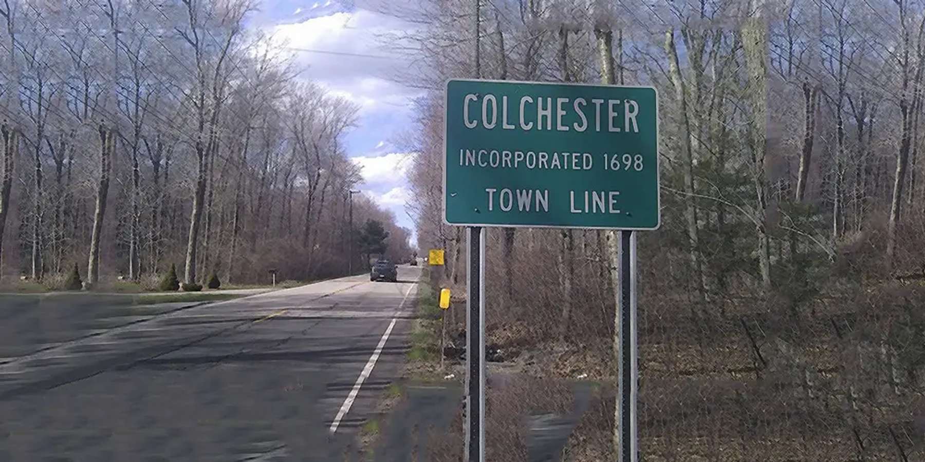 Photo of a town line sign in Colchester, Connecticut Photo of a town line sign in Colchester, Connecticut