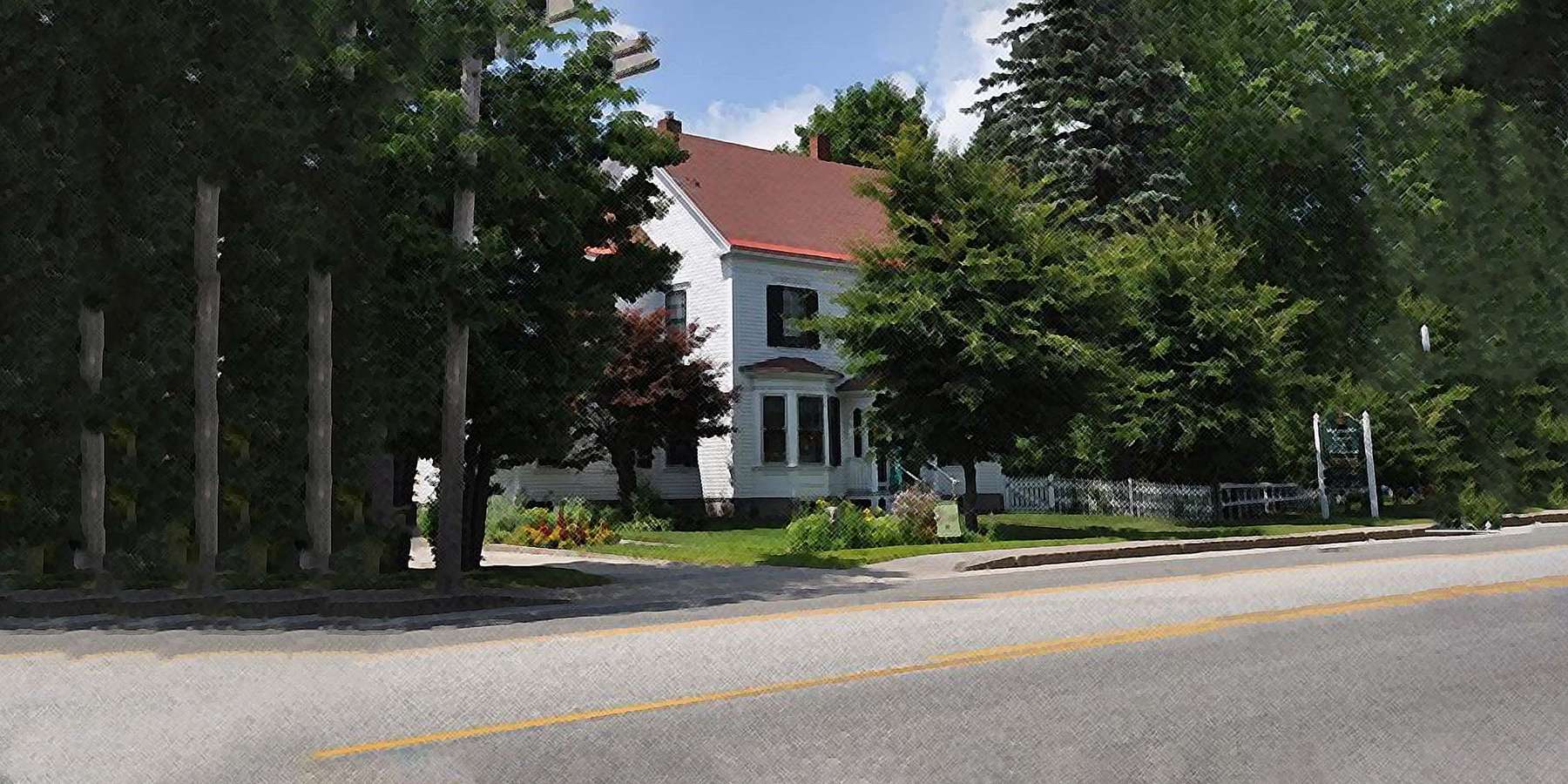 Photo of McLaughlin House and Garden, located in South Paris, Maine, surrounded by trees on a sunny day Photo of McLaughlin House and Garden, located in South Paris, Maine, surrounded by trees on a sunny day