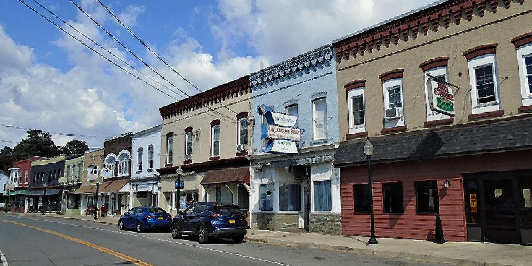 A photo of Main Street with colorful buildings in Broadalbin, New York A photo of Main Street with colorful buildings in Broadalbin, New York