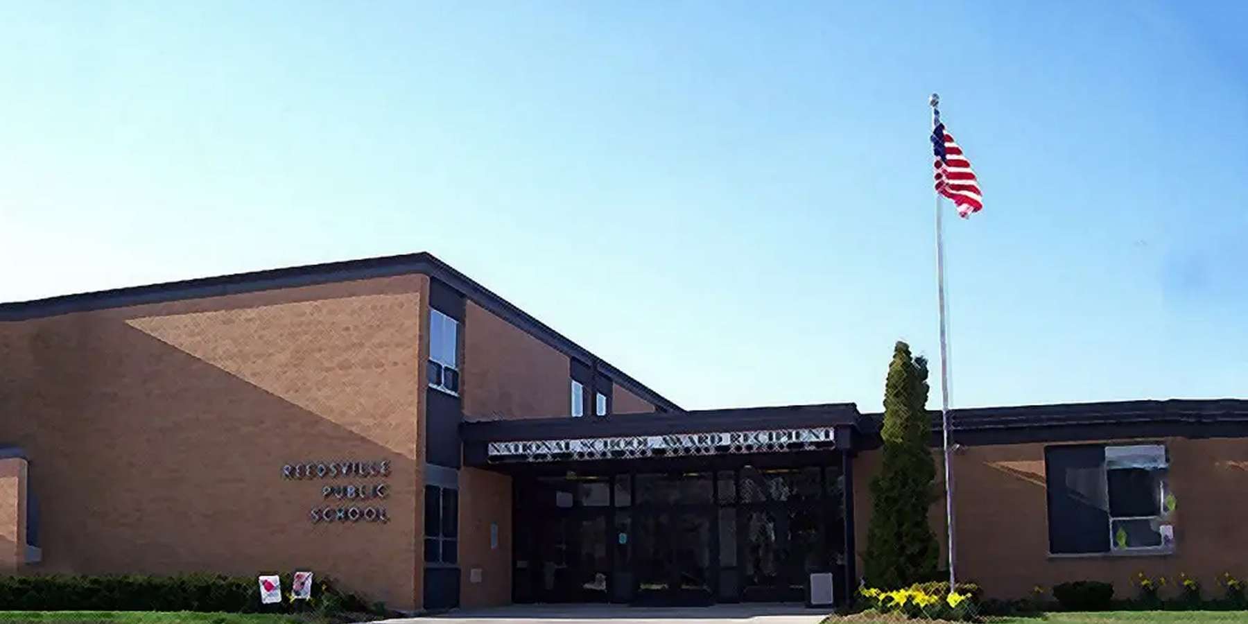 A photo of Reedsville Public School with a flag located in Reedsville, Pennsylvania A photo of Reedsville Public School with a flag located in Reedsville, Pennsylvania