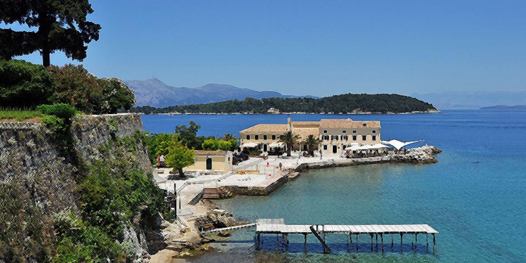 A photo of a beach with a hotel on an island located in Corfu, New York A photo of a beach with a hotel on an island located in Corfu, New York