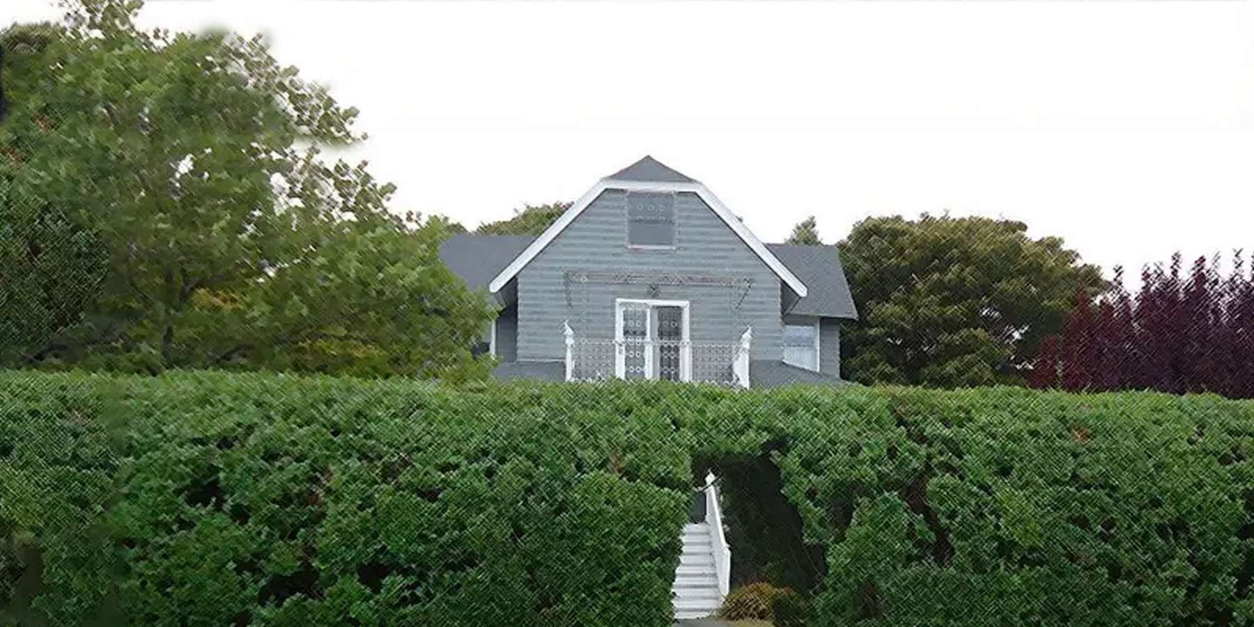 Photo of a house with a hedge doorway on a peninsula in Marblehead, Massachusetts Photo of a house with a hedge doorway on a peninsula in Marblehead, Massachusetts