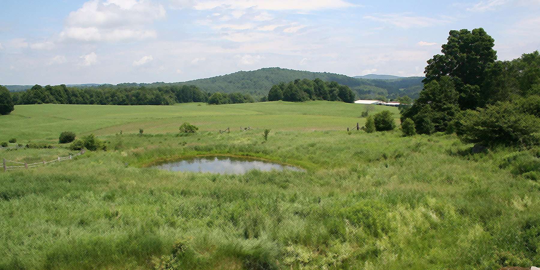 Photo of a grassland wind pond and mountain in East Fairfield, Vermont Photo of a grassland wind pond and mountain in East Fairfield, Vermont