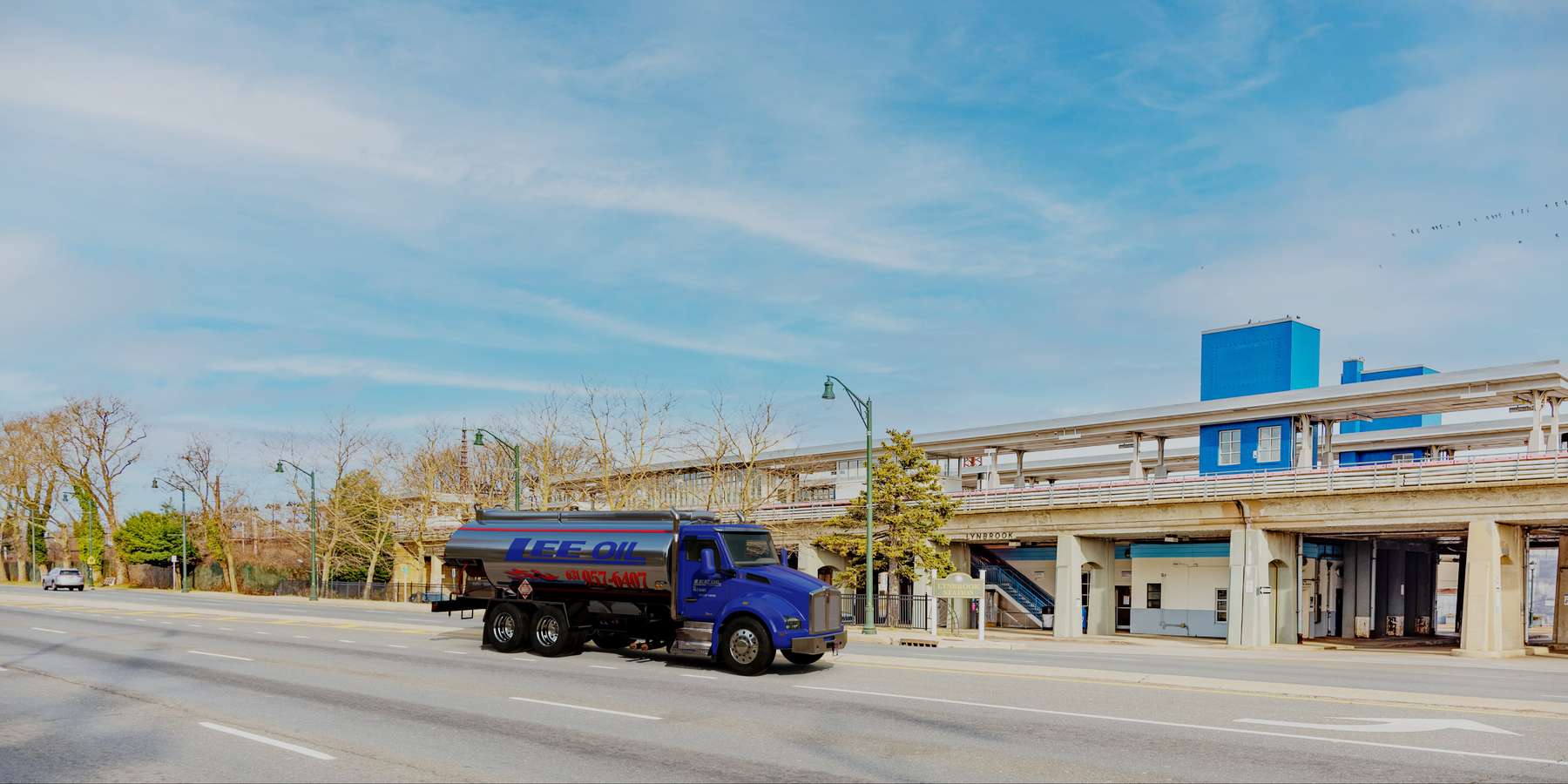 Residential heating oil truck parked in the LIRR station parking lot in Lynbrook, Long Island, New York delivering fuel oil. Residential heating oil truck parked in the LIRR station parking lot in Lynbrook, Long Island, New York delivering fuel oil.