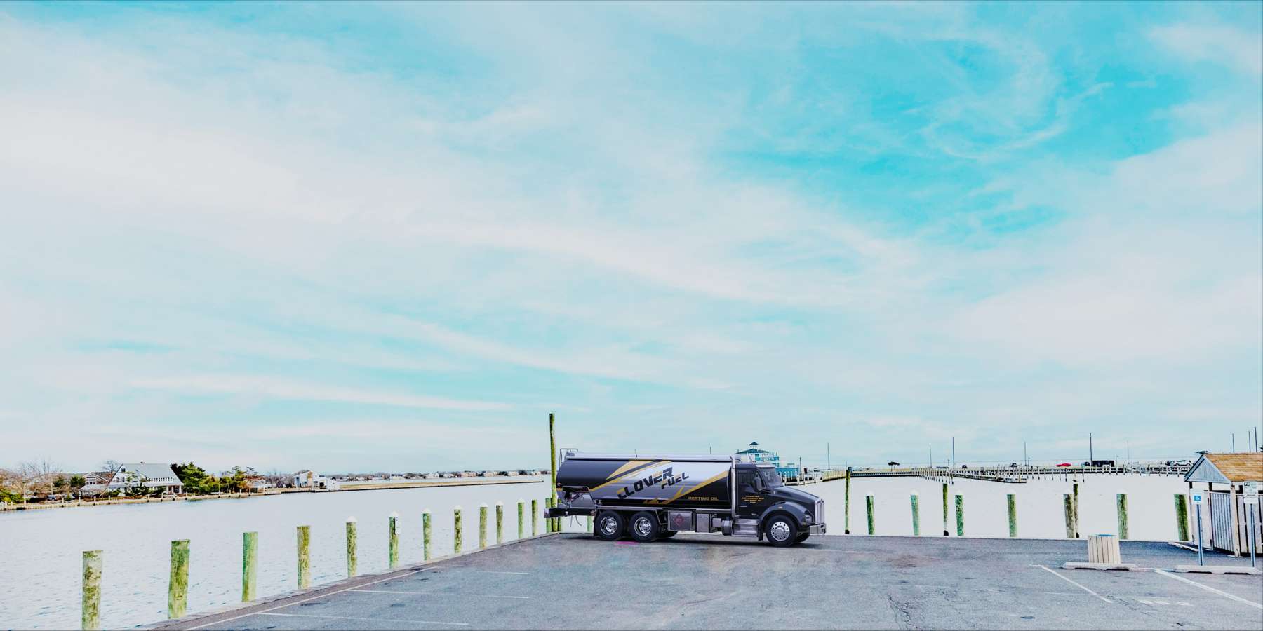 Residential heating oil truck parked on a ferry dock in Bay Shore, Long Island, New York delivering fuel oil. Residential heating oil truck parked on a ferry dock in Bay Shore, Long Island, New York delivering fuel oil.