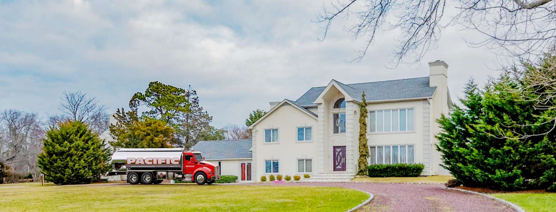 Pacific Fuel Oil Heating Oil Truck Pacific Fuel Oil residential home heating oil truck in front of a white stucco bungalow with a red gravel driveway in Cedarhurst, Long Island, New York delivering fuel oil.