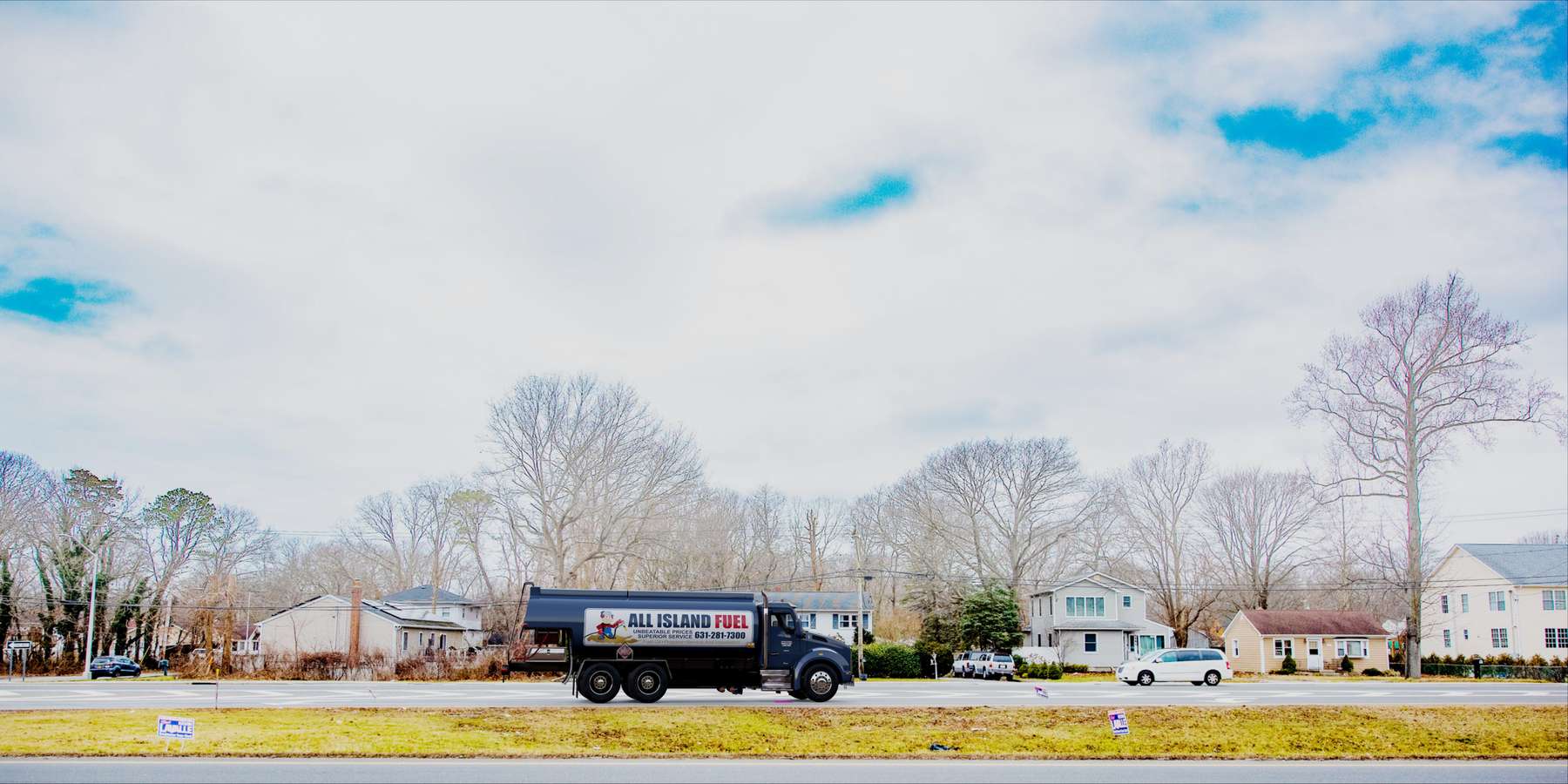Residential heating oil truck on a divided highway in Shirley, Long Island, New York delivering fuel oil. Residential heating oil truck on a divided highway in Shirley, Long Island, New York delivering fuel oil.