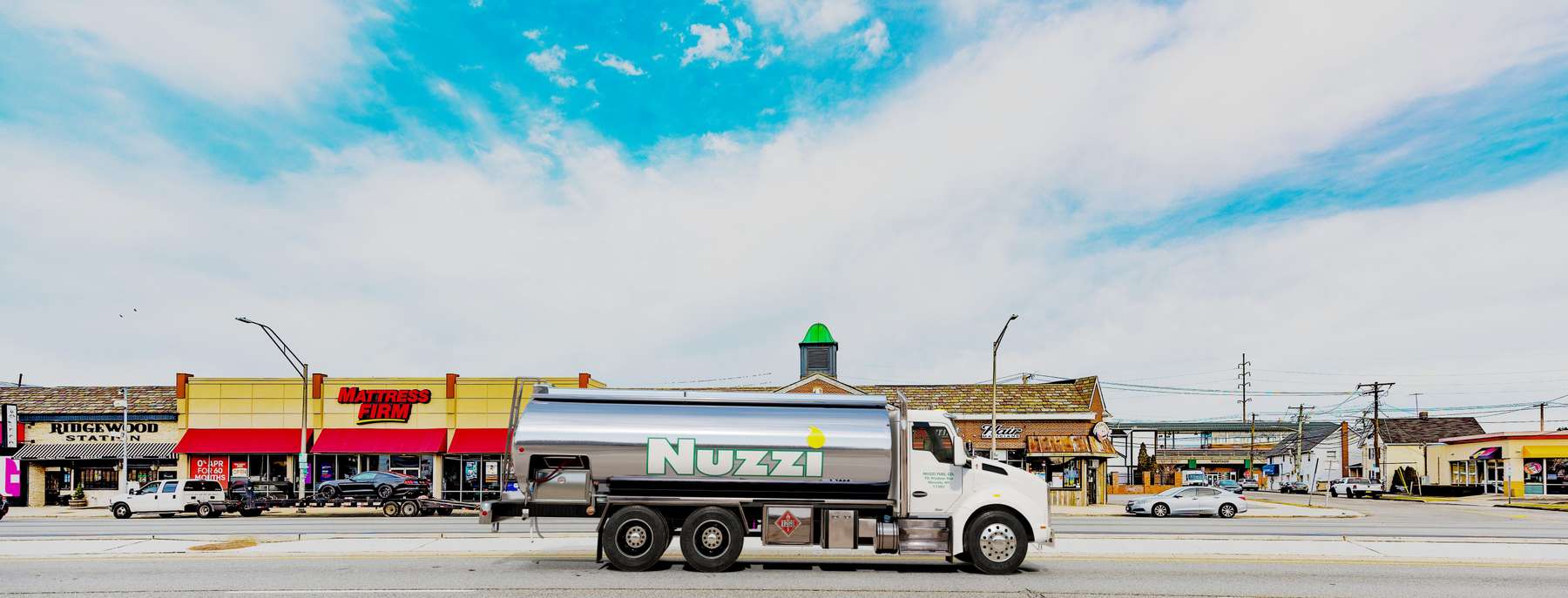 Sage Oil Service Heating Oil Truck  Sage Oil Service residential home heating oil truck in the shopping district in Quogue, Long Island, New York delivering fuel oil.