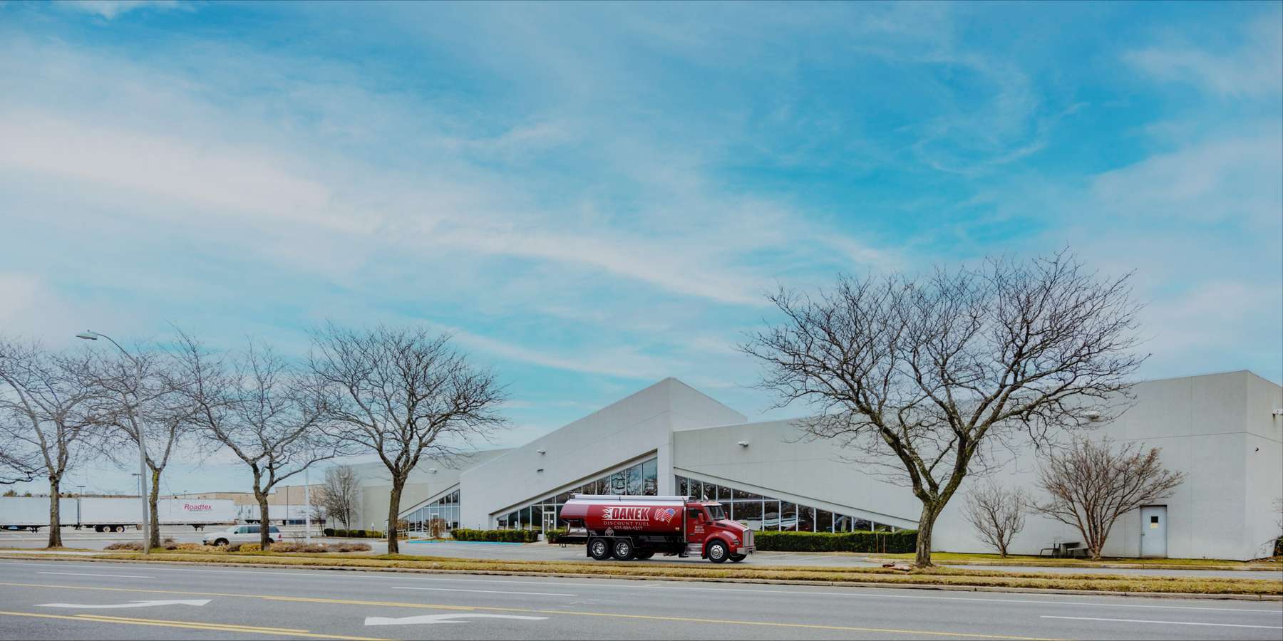 Residential heating oil truck parked in front of a factory in Bohemia, Long Island, New York delivering fuel oil. Residential heating oil truck parked in front of a factory in Bohemia, Long Island, New York delivering fuel oil.