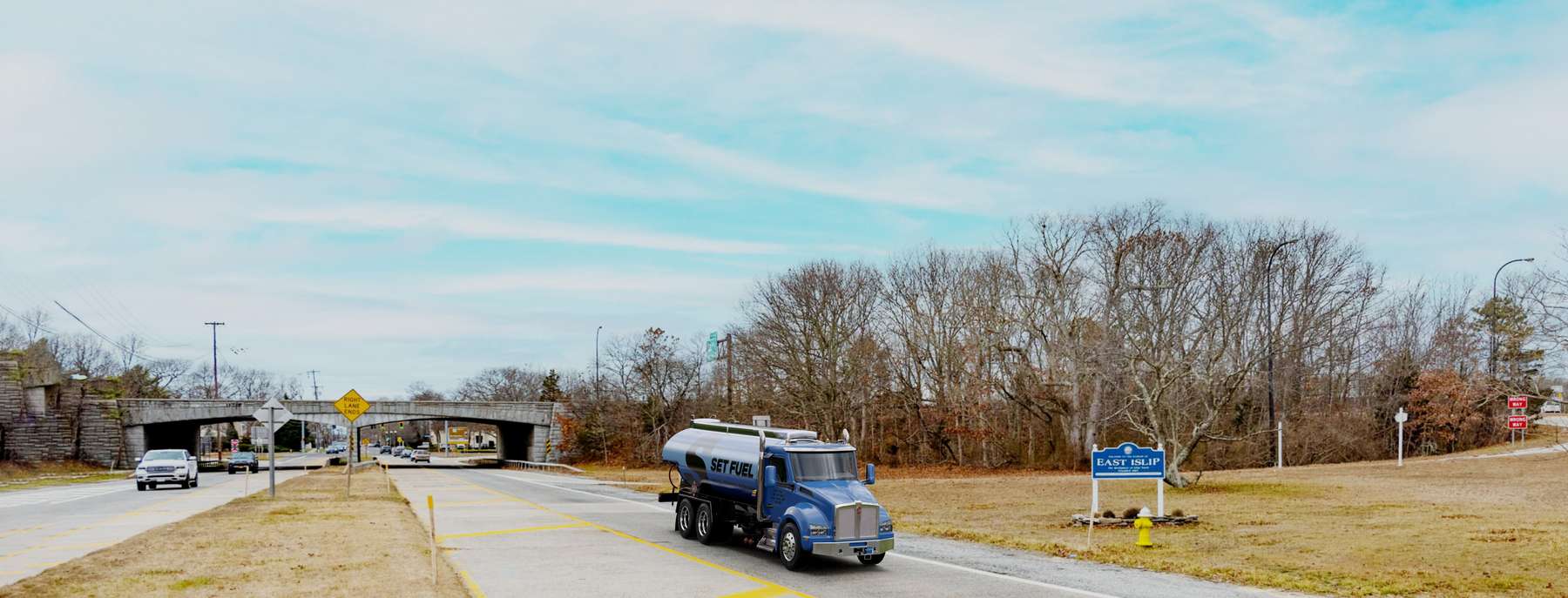 Set Fuel Heating Oil Truck Set Fuel residential home heating oil truck with a sign demarking the town border in East Islip, Long Island, New York delivering fuel oil.