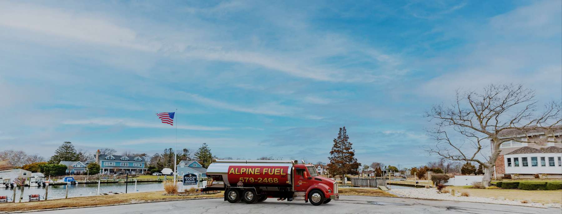 Alpine Fuel Heating Oil Truck Alpine Fuel residential home heating oil truck in the tony Saxon Cove gated community in East Islip, Long Island, New York delivering fuel oil.