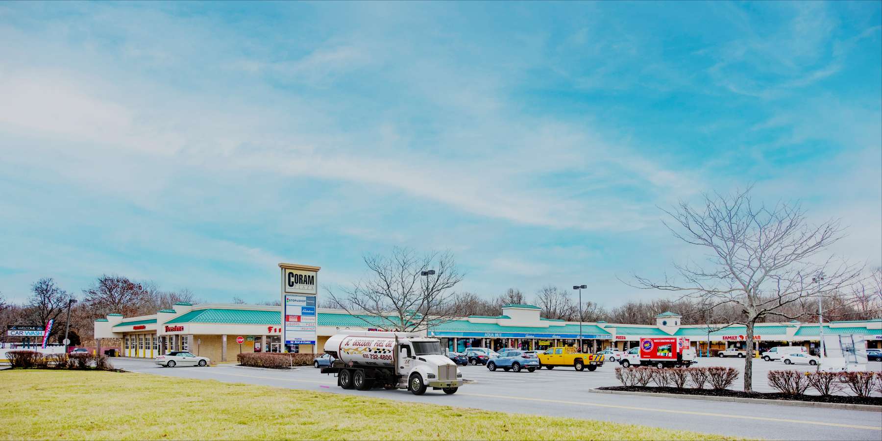 Residential heating oil truck at Coram Plaza in Coram, Long Island, New York delivering fuel oil. Residential heating oil truck at Coram Plaza in Coram, Long Island, New York delivering fuel oil.