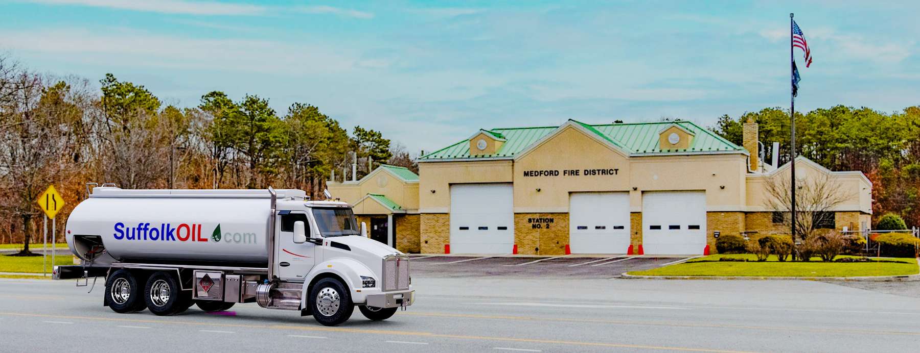 Suffolkoil Heating Oil Truck Suffolkoil residential home heating oil truck in front of a brick and stucco building in Medford, Long Island, New York delivering fuel oil.