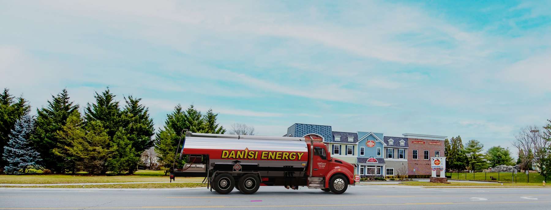 Diamond Fuel & Burner Heating Oil Truck Diamond Fuel & Burner residential home heating oil truck in front of a beachfront home with a mini cooper and a classic pickup truck parked in the driveway in Patchogue, Long Island, New York delivering fuel oil.