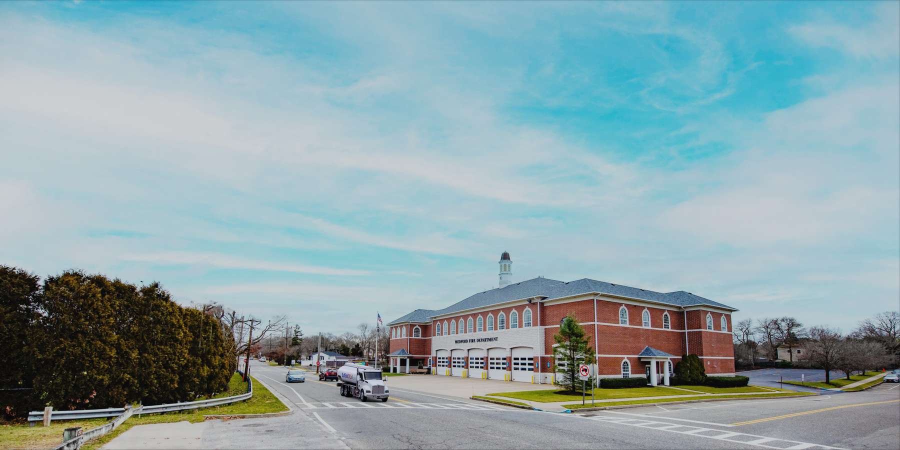 Residential heating oil truck parked in front of the fire department in Medford, Long Island, New York delivering fuel oil. Residential heating oil truck parked in front of the fire department in Medford, Long Island, New York delivering fuel oil.