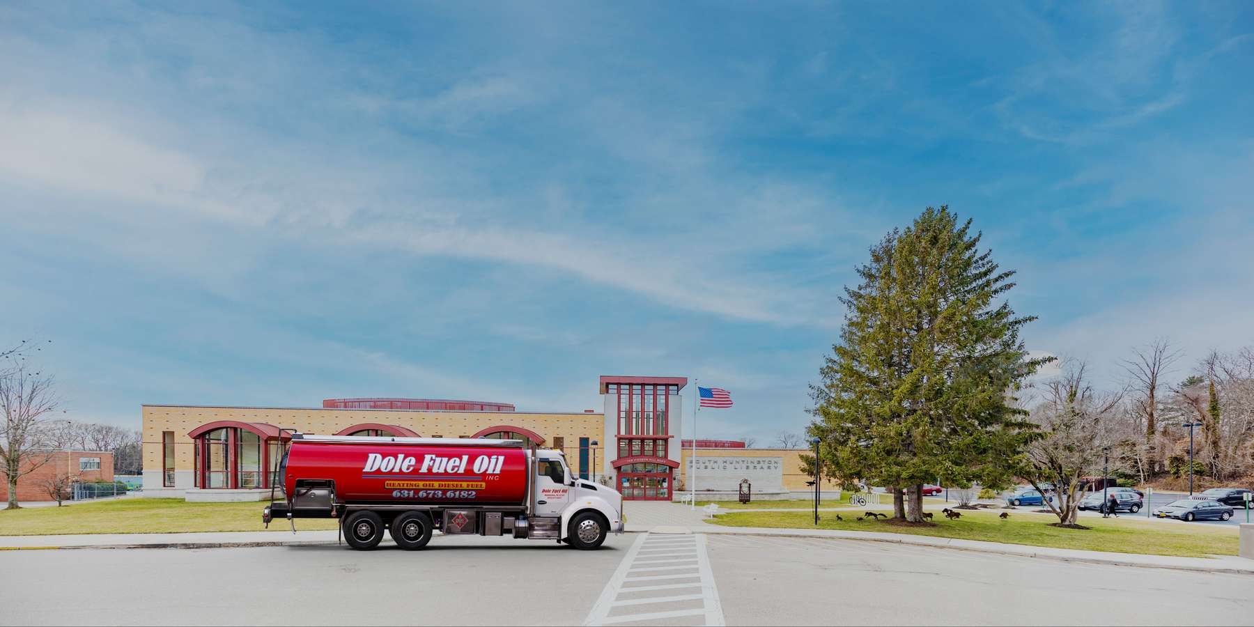 Residential heating oil truck in front of the South Huntington Public Library in Huntington, Long Island, New York delivering fuel oil. Residential heating oil truck in front of the South Huntington Public Library in Huntington, Long Island, New York delivering fuel oil.