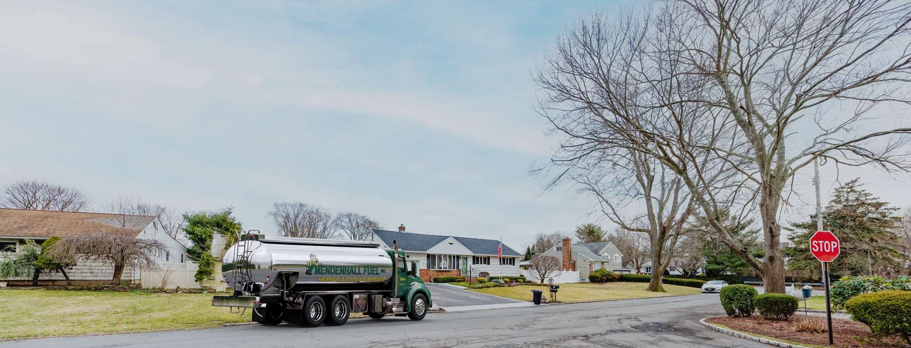 Mendenhall Fuel Heating Oil Truck Mendenhall Fuel residential home heating oil truck outside of a home on Rutland Lane with a star ornament in Melville, Long Island, New York delivering fuel oil.
