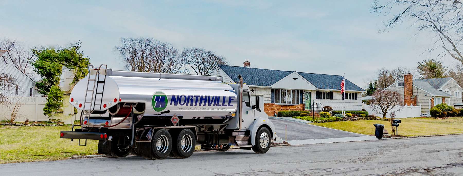 Oil 4 Less Heating Oil Truck Oil 4 Less residential home heating oil truck in front of a white house in Huntington, Long Island, New York delivering fuel oil.