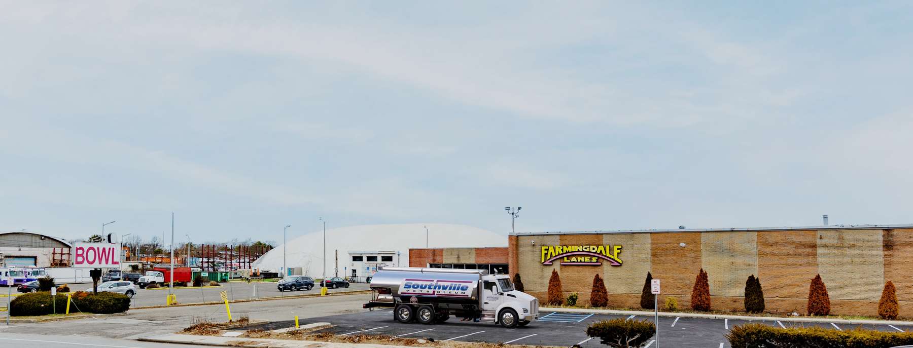 State Utilities Heating Oil Truck  State Utilities residential home heating oil truck with a service van in Bethpage, Long Island, New York delivering fuel oil.