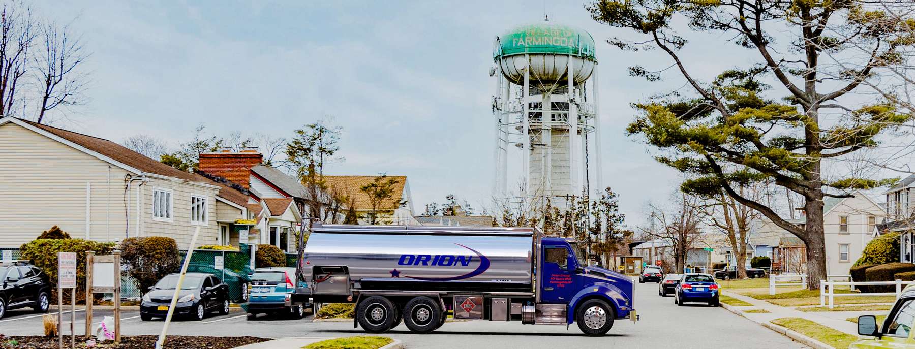 Pacific Fuel Oil Heating Oil Truck Pacific Fuel Oil residential home heating oil truck in front of a white stucco bungalow with a red gravel driveway in Cedarhurst, Long Island, New York delivering fuel oil.