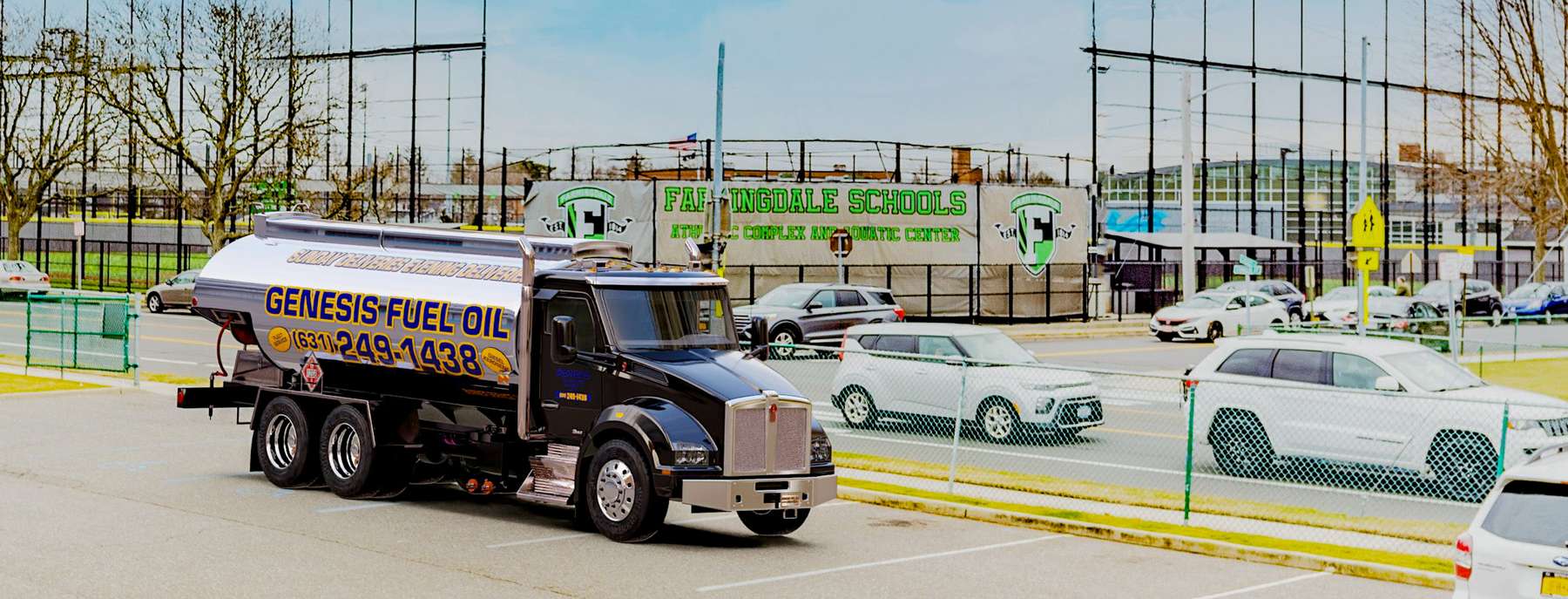 Grissom Fuel Heating Oil Truck Grissom Fuel residential home heating oil truck next to a clock tower in Wyandanch, Long Island, New York delivering fuel oil.