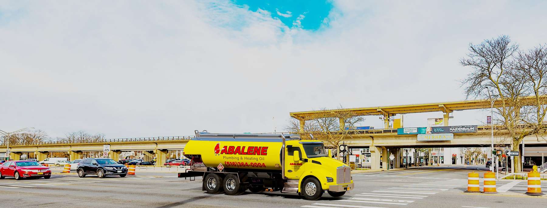 Action Fuel & Burner Service Heating Oil Truck Action Fuel & Burner Service residential home heating oil truck in the town center at the corner of Sunrise Highway and Peninsula Boulevard in Islip, Long Island, New York delivering fuel oil.