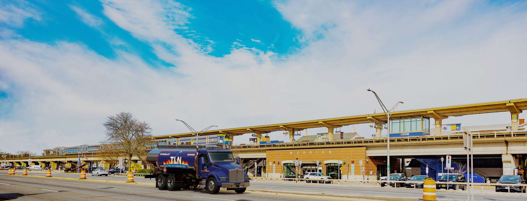 T.L.N. Fuel Heating Oil Truck T.L.N. Fuel residential home heating oil truck next to an eastbound double decker train in Merrick, Long Island, New York delivering fuel oil.