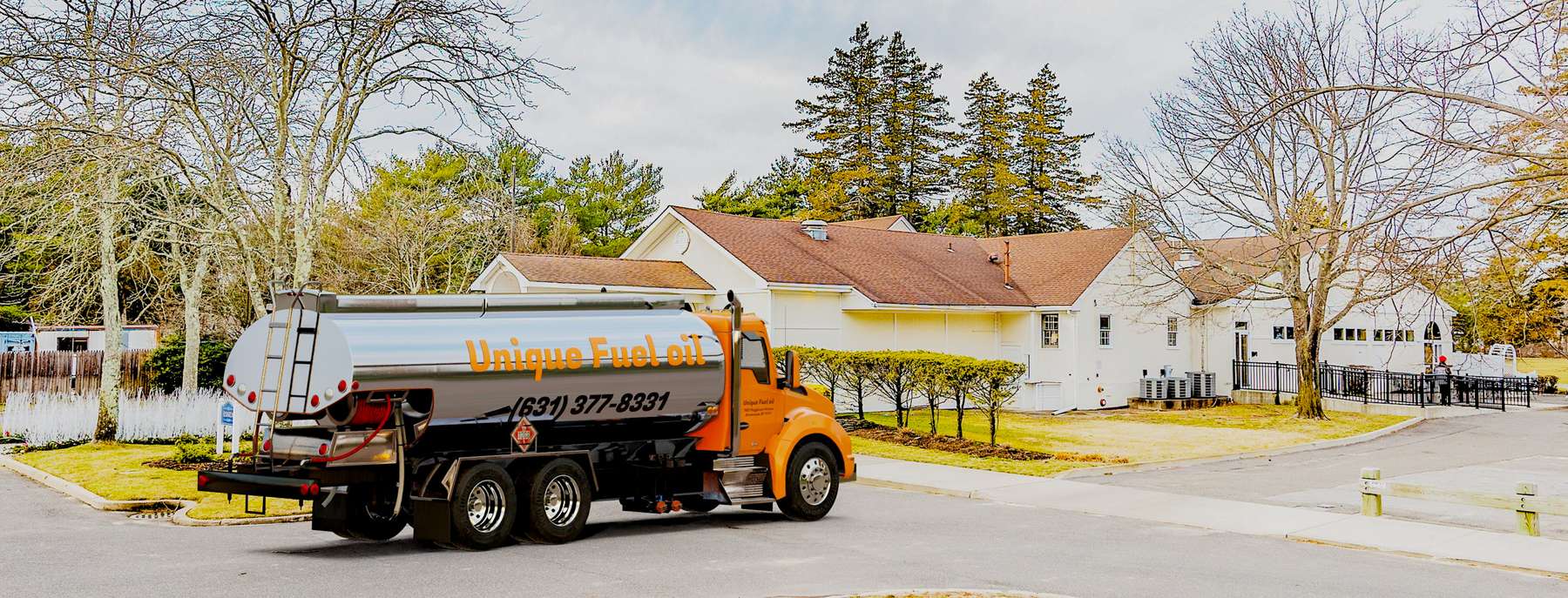 Unique Fuel Oil Heating Oil Truck Unique Fuel Oil residential home heating oil truck at the entrance portico in Brentwood, Long Island, New York delivering fuel oil.