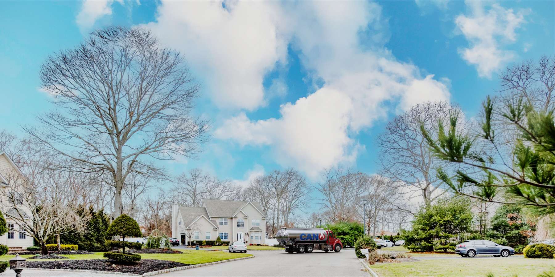 Residential heating oil truck parked on a cul de sac in Brentwood, Long Island, New York delivering fuel oil. Residential heating oil truck parked on a cul de sac in Brentwood, Long Island, New York delivering fuel oil.