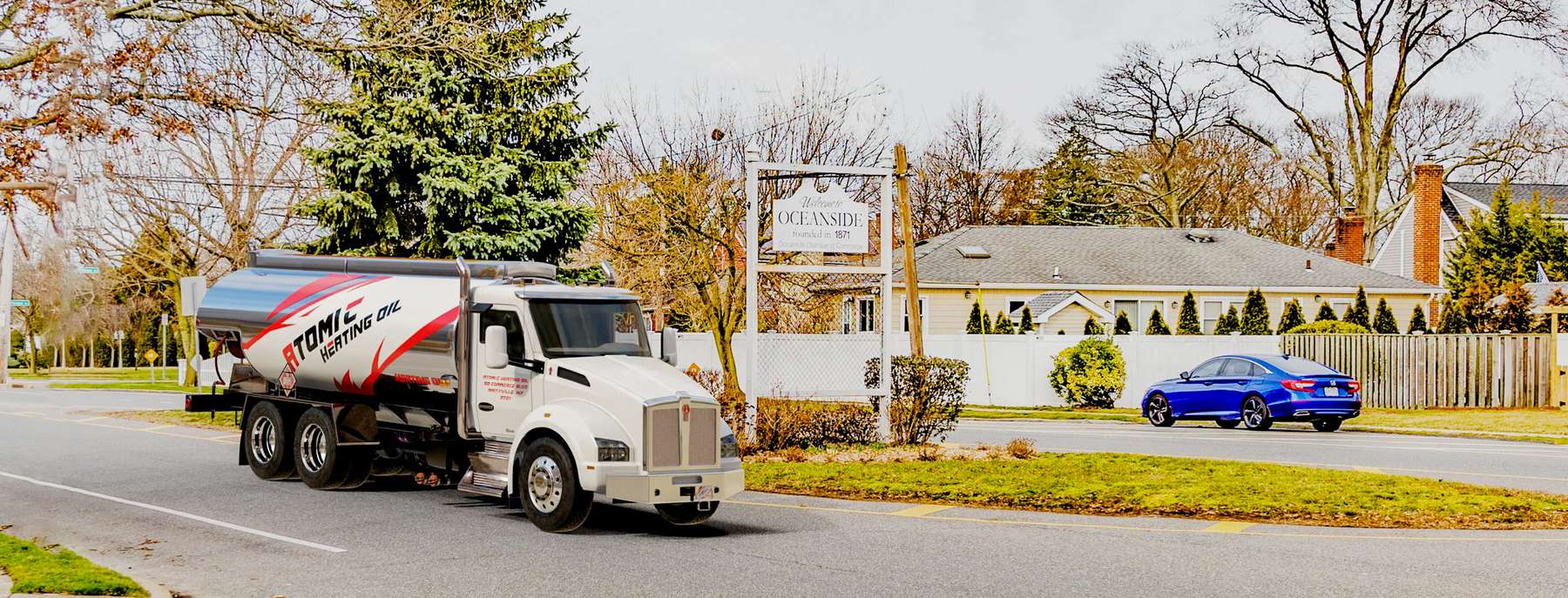 Atomic Heating Oil Heating Oil Truck Atomic Heating Oil residential home heating oil truck at the intersection of Foxhurst and Westlake in Oceanside, Long Island, New York delivering fuel oil.