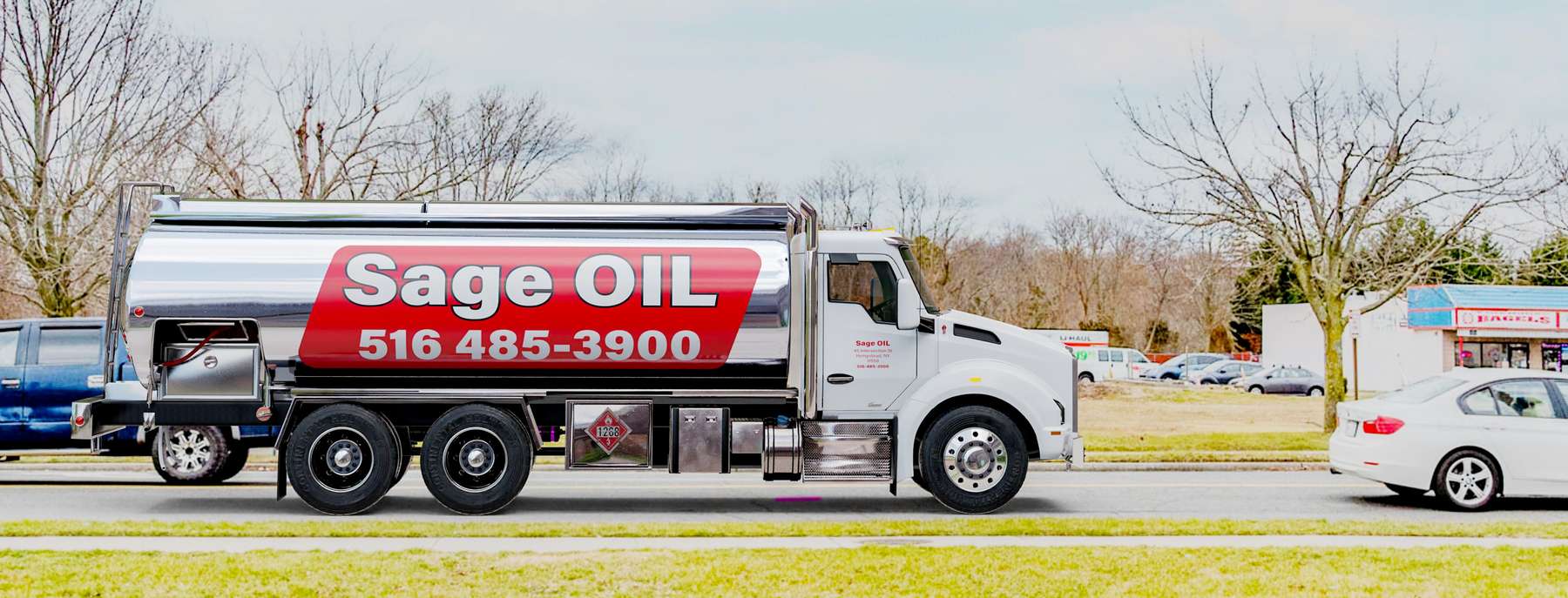 Pacific Fuel Oil Heating Oil Truck Pacific Fuel Oil residential home heating oil truck in front of a white stucco bungalow with a red gravel driveway in Cedarhurst, Long Island, New York delivering fuel oil.