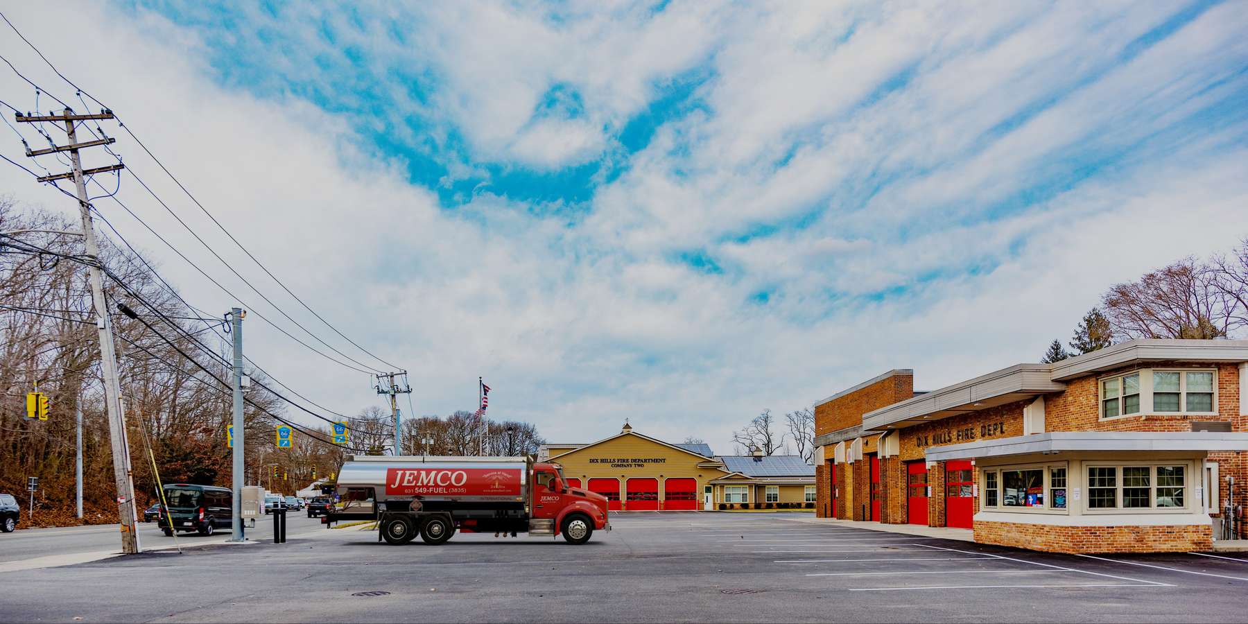 Residential heating oil truck in the Company Two parking lot in Huntington Station, Long Island, New York delivering fuel oil. Residential heating oil truck in the Company Two parking lot in Huntington Station, Long Island, New York delivering fuel oil.
