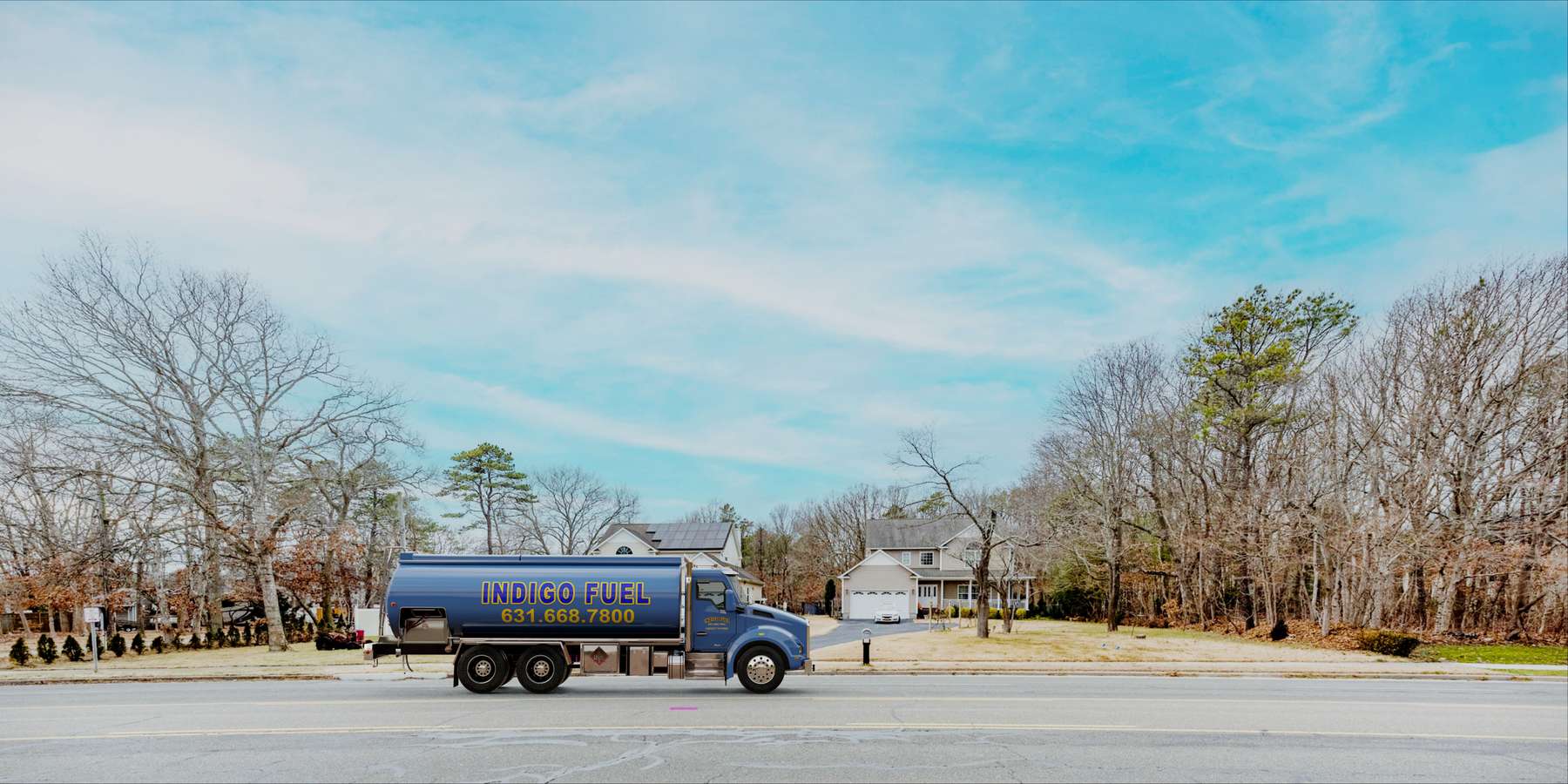 Residential heating oil truck in a suburban community in Montauk, Long Island, New York delivering fuel oil. Residential heating oil truck in a suburban community in Montauk, Long Island, New York delivering fuel oil.