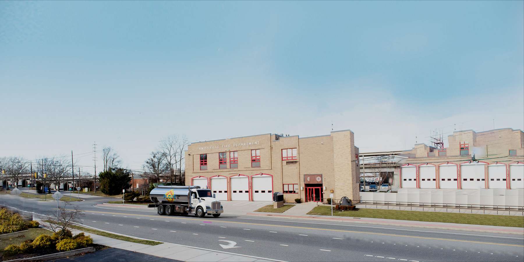 Residential heating oil truck parked in front of the firehouse in Amityville, Long Island, New York delivering fuel oil. Residential heating oil truck parked in front of the firehouse in Amityville, Long Island, New York delivering fuel oil.