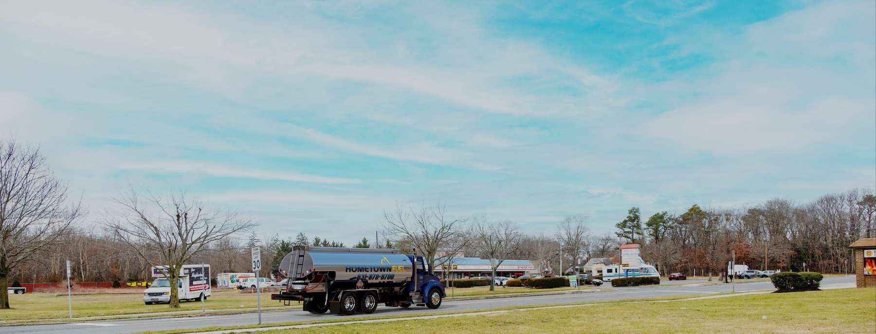 Hometown Express Fuel Heating Oil Truck Hometown Express Fuel residential home heating oil truck in the downtown shopping district in Holtsville, Long Island, New York delivering fuel oil.