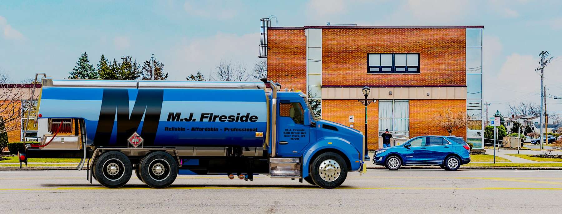 Mulry Fuel Heating Oil Truck Mulry Fuel residential home heating oil truck on a sunny afternoon parked on Coxtie Green Rd in Brentwood, Long Island, New York delivering fuel oil.