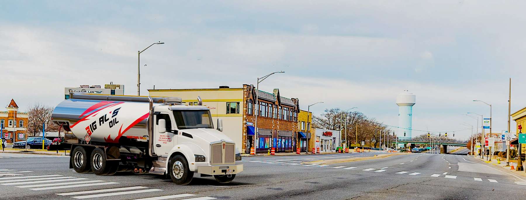 Anjon Heating Oil Truck Anjon residential home heating oil truck in front of a gray single family residence in Huntington, Long Island, New York delivering fuel oil.