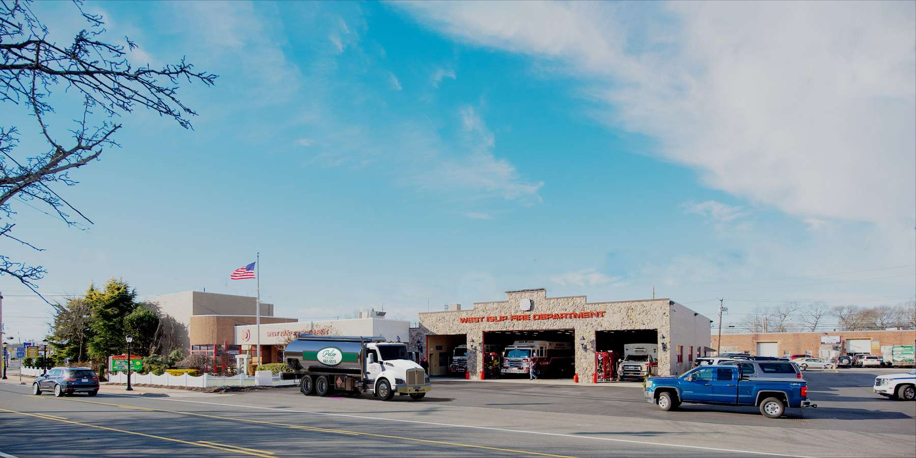 Residential heating oil truck parked in front of the fire house in West Islip, Long Island, New York delivering fuel oil. Residential heating oil truck parked in front of the fire house in West Islip, Long Island, New York delivering fuel oil.