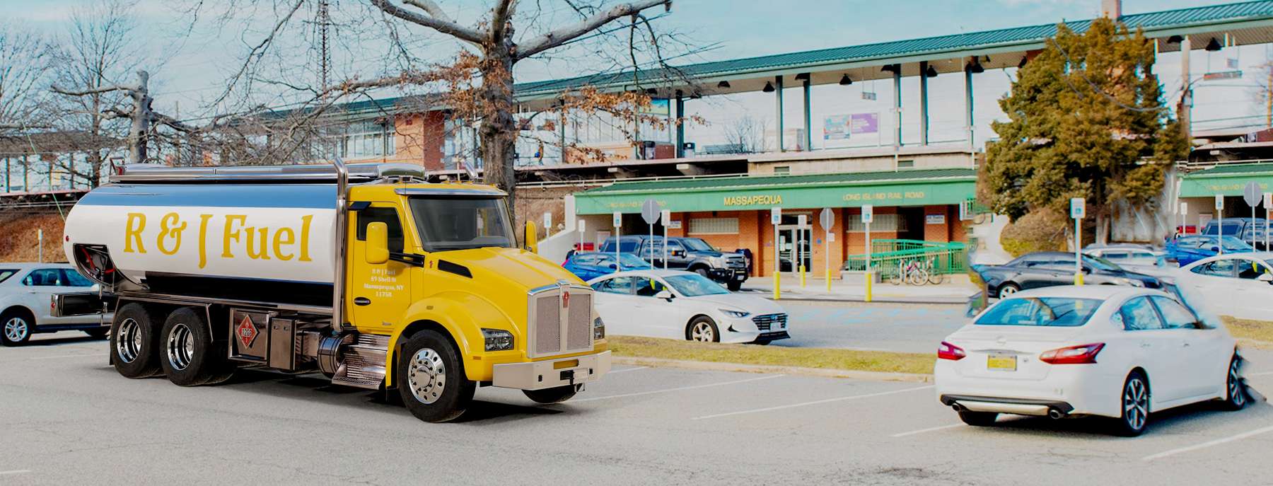 R & J Fuel Heating Oil Truck R & J Fuel residential home heating oil truck in a parking lot with a tree in Massapequa, Long Island, New York delivering fuel oil.
