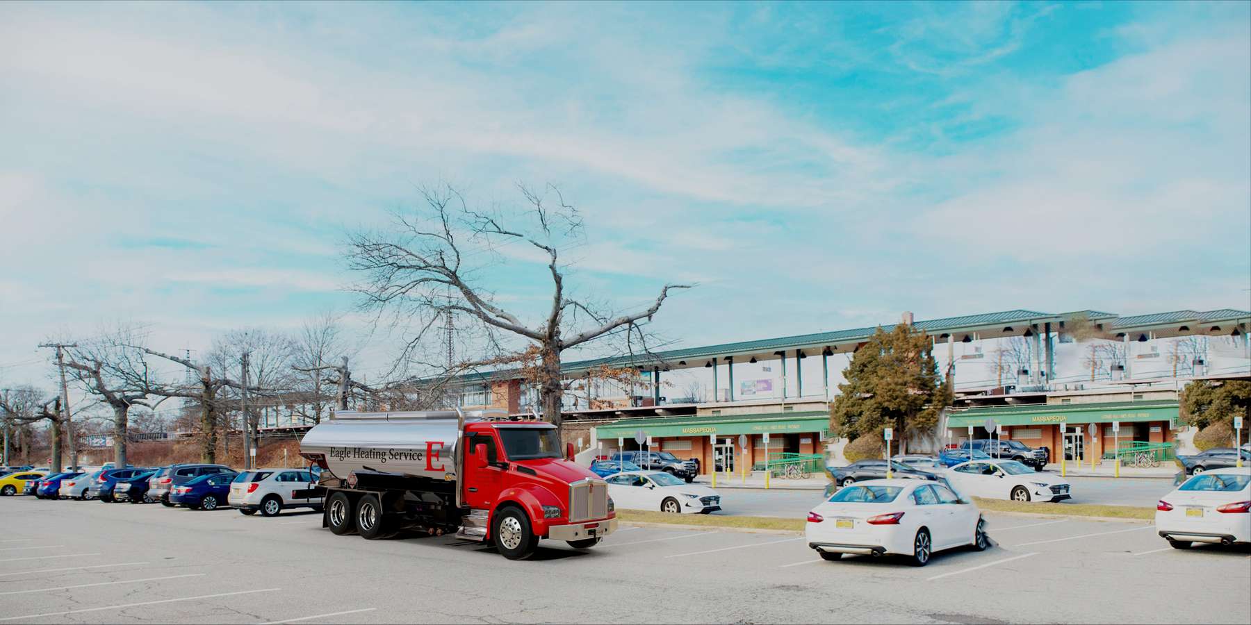 Residential heating oil truck at the LIRR station in Massapequa, Long Island, New York delivering fuel oil. Residential heating oil truck at the LIRR station in Massapequa, Long Island, New York delivering fuel oil.