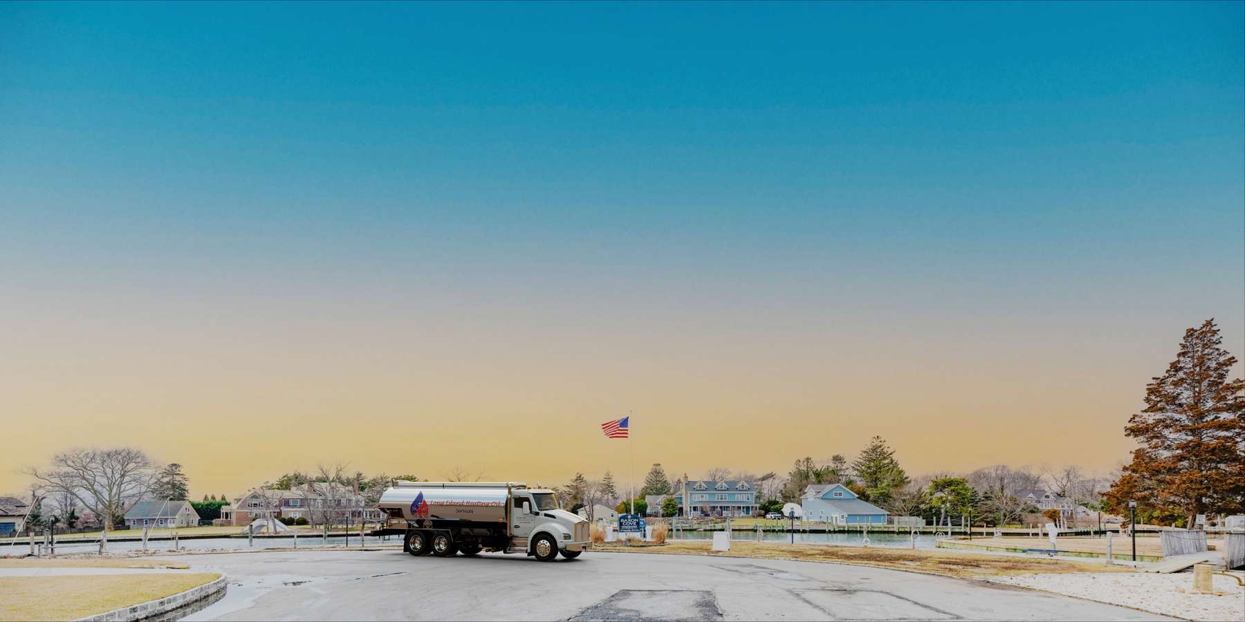 Residential heating oil truck at sunset in Islip Terrace, Long Island, New York delivering fuel oil. Residential heating oil truck at sunset in Islip Terrace, Long Island, New York delivering fuel oil.
