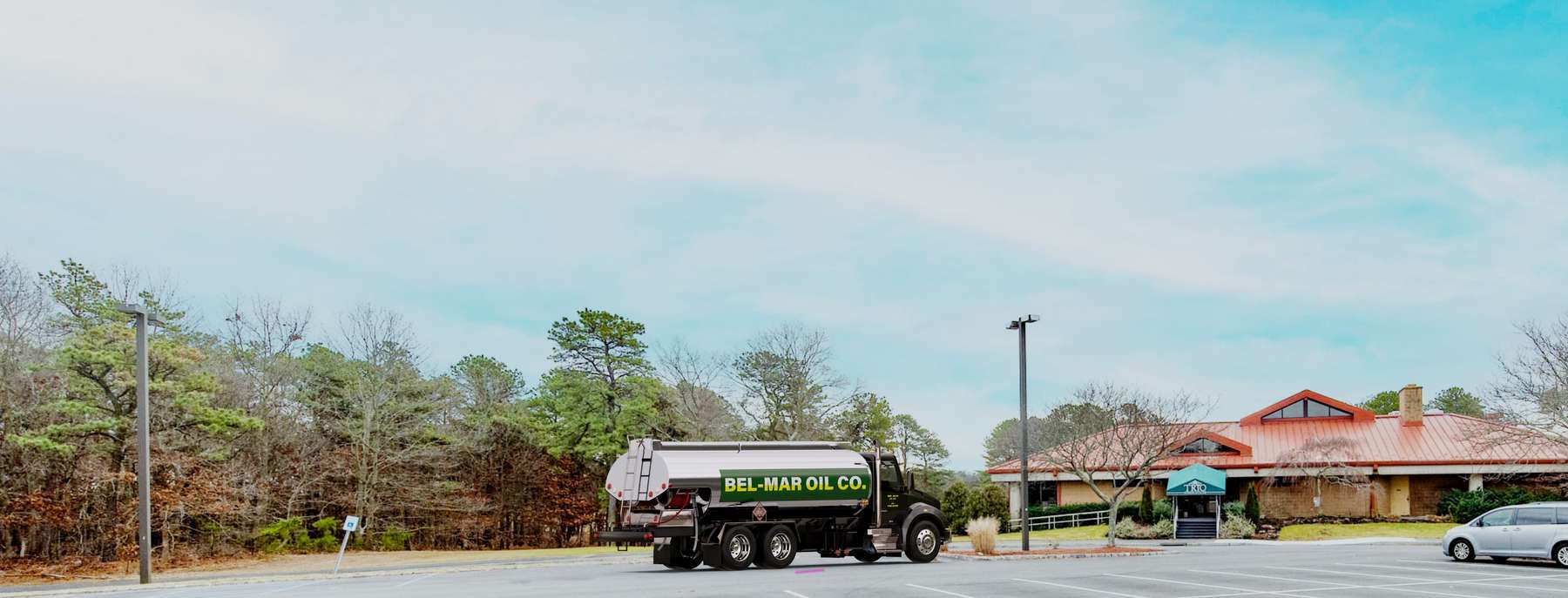 Ben Oil Heating Oil Truck Ben Oil residential home heating oil truck in a recreational area with bike racks and snow plows in Lindenhurst, Long Island, New York delivering fuel oil.