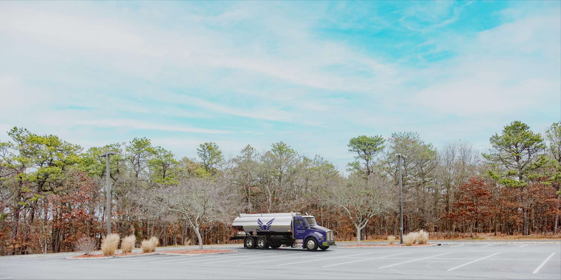 Residential heating oil truck in a parking lot in Mount Sinai, Long Island, New York delivering fuel oil. Residential heating oil truck in a parking lot in Mount Sinai, Long Island, New York delivering fuel oil.