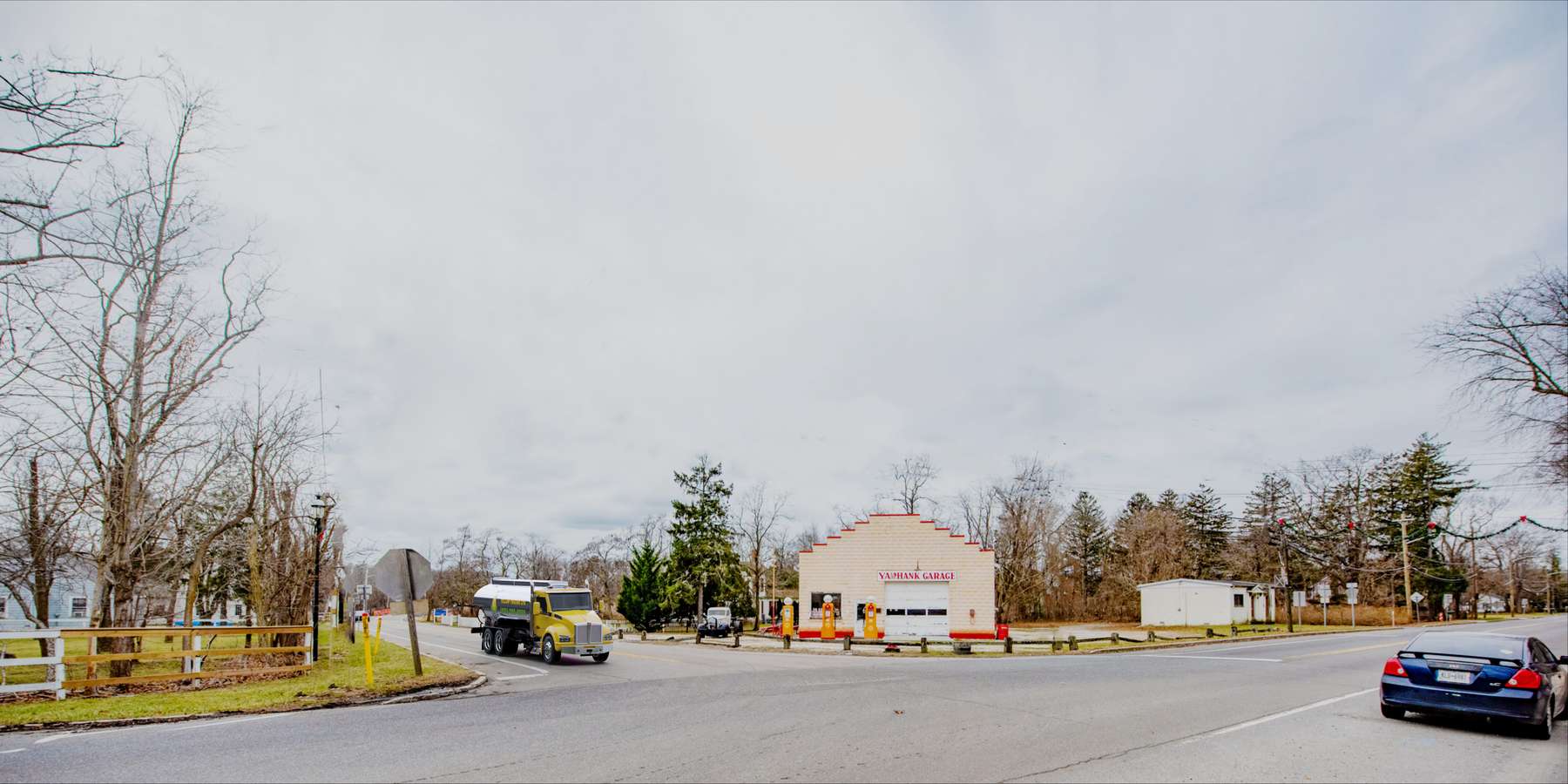 Residential heating oil truck parked in front of a garage in Yaphank, Long Island, New York delivering fuel oil. Residential heating oil truck parked in front of a garage in Yaphank, Long Island, New York delivering fuel oil.