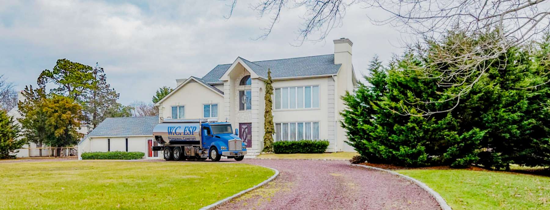 W. F. Mccoy Heating Oil Truck W. F. Mccoy residential home heating oil truck at a white seaside residence in Bridgehampton, Long Island, New York delivering fuel oil.