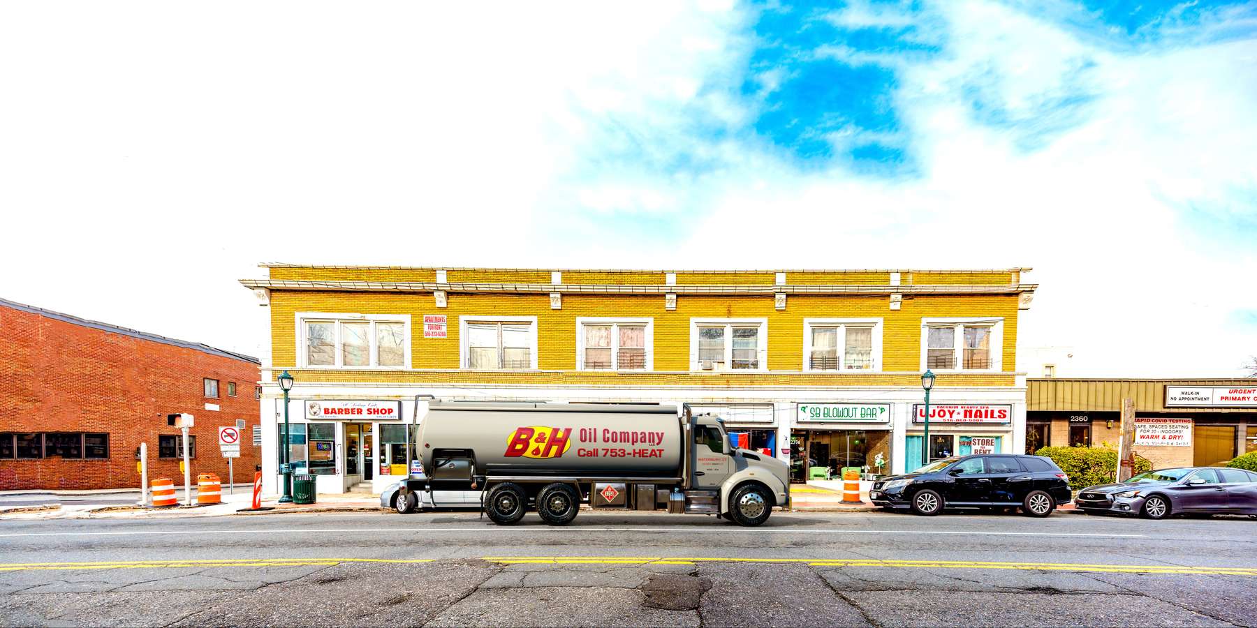 B & H Oil's Heating Oil Truck B & H Oil's Heating Oil Truck parked in front of barbar shop