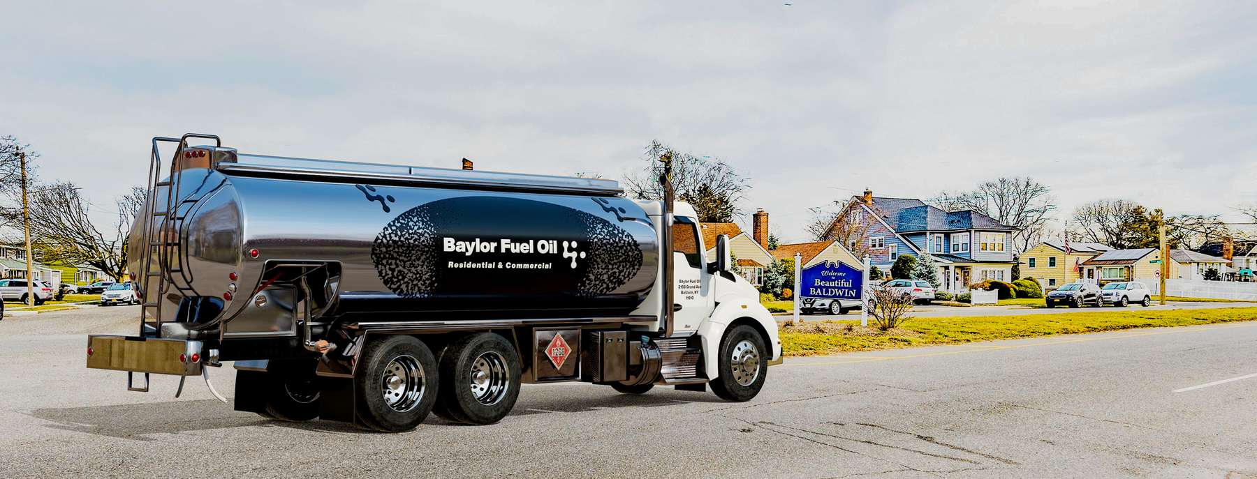 Blue Flame Fuel Heating Oil Truck  Blue Flame Fuel residential home heating oil truck in front of the middle school in Shirley, Long Island, New York delivering fuel oil.