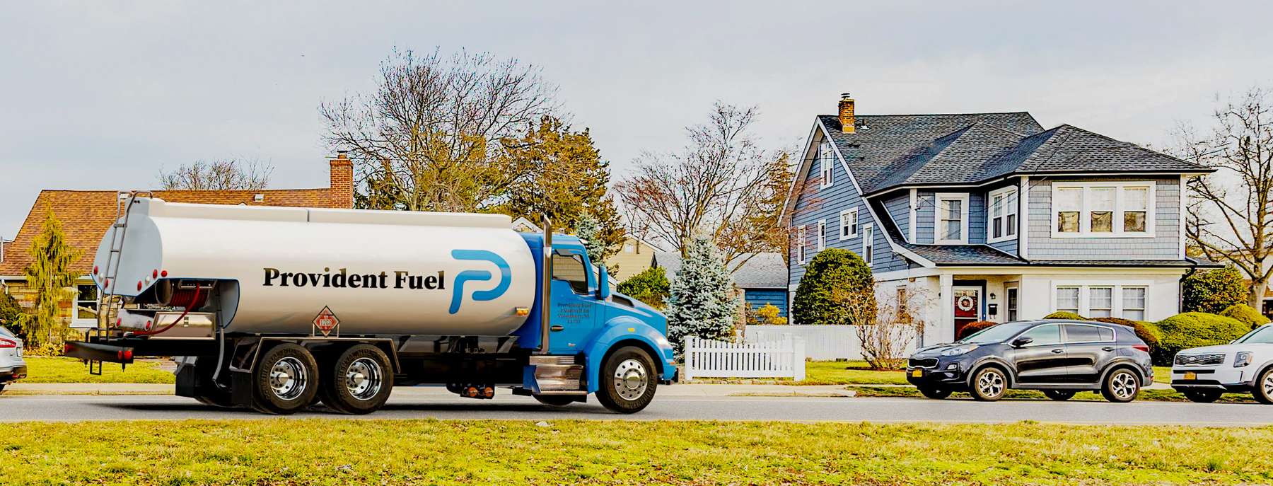 Provident Fuel Heating Oil Truck Provident Fuel residential home heating oil truck in front of an ochre and a gray home in Baldwin, Long Island, New York delivering fuel oil.