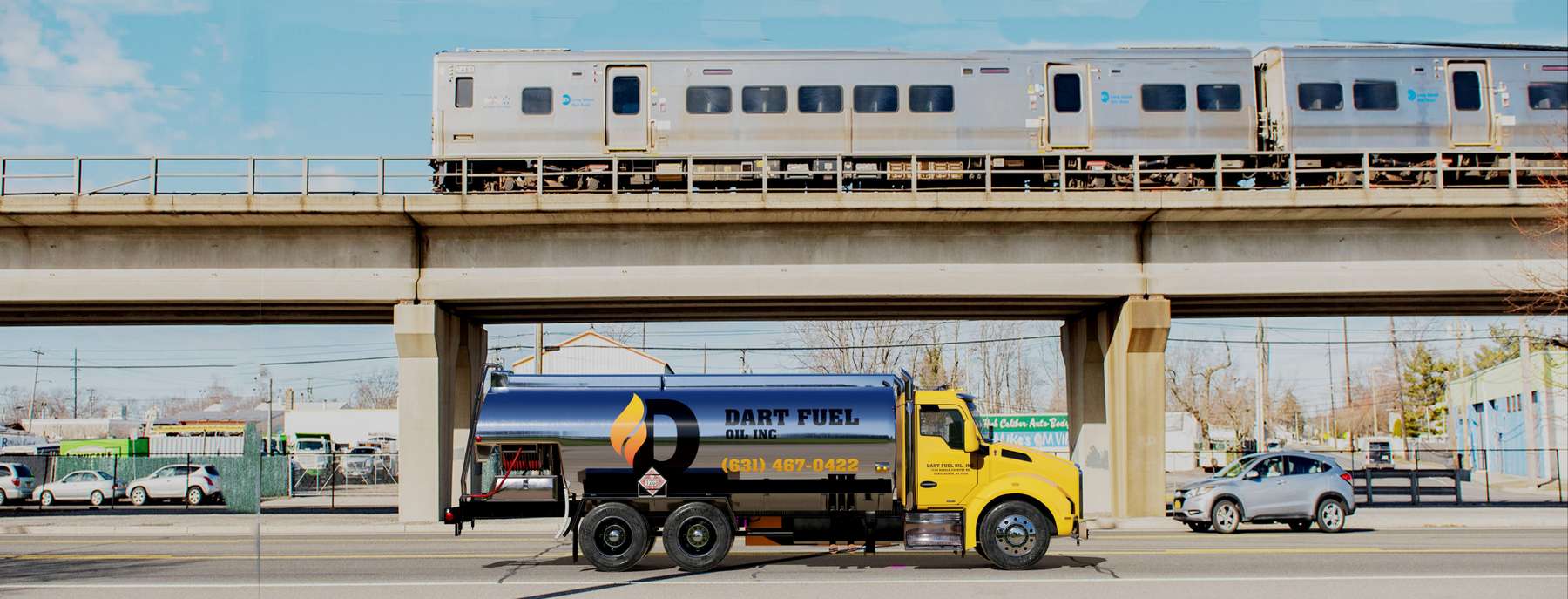 Dart Fuel Heating Oil Truck Dart Fuel residential home heating oil truck in front of an elevated railroad in Lindenhurst, Long Island, New York delivering fuel oil.